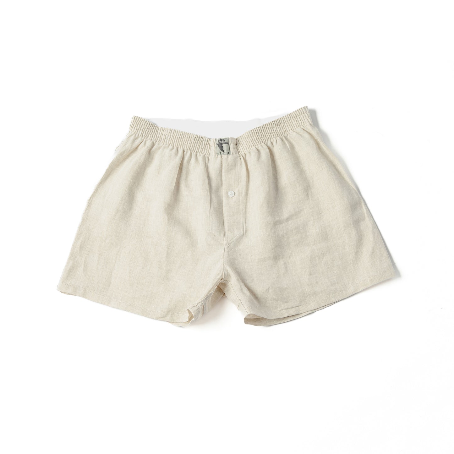 A pair of beige 100% linen men's boxer shorts with a visible elastic waistband.