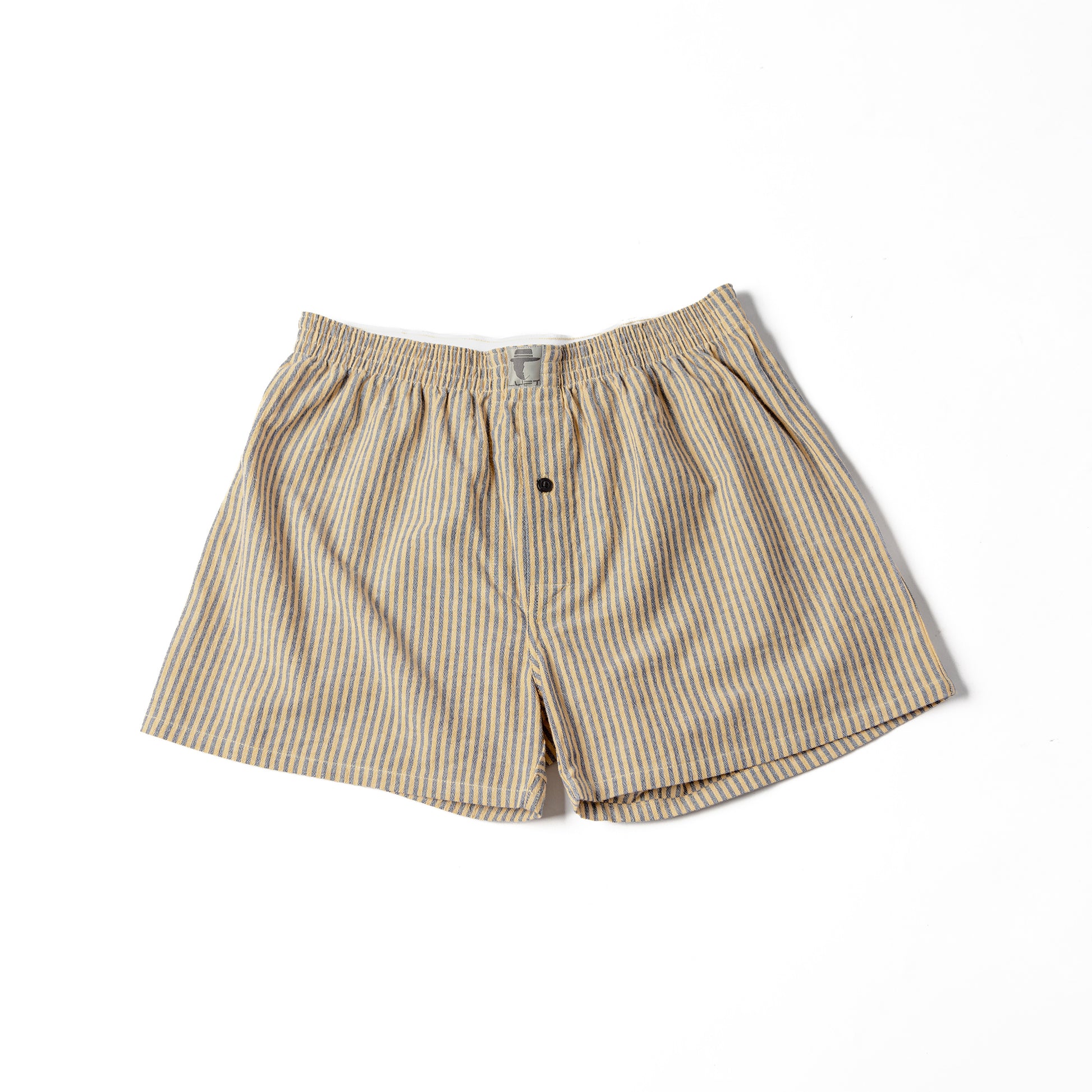 A pair of striped cotton shorts in yellow and black, with a button at the waist.
